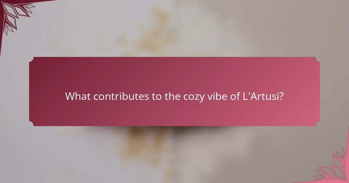What contributes to the cozy vibe of L'Artusi?